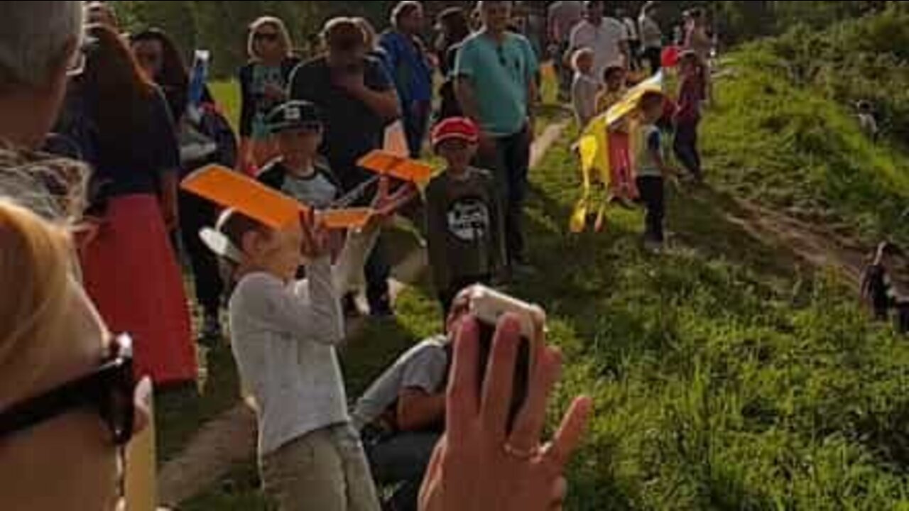 Child takes paper plane full in the face!