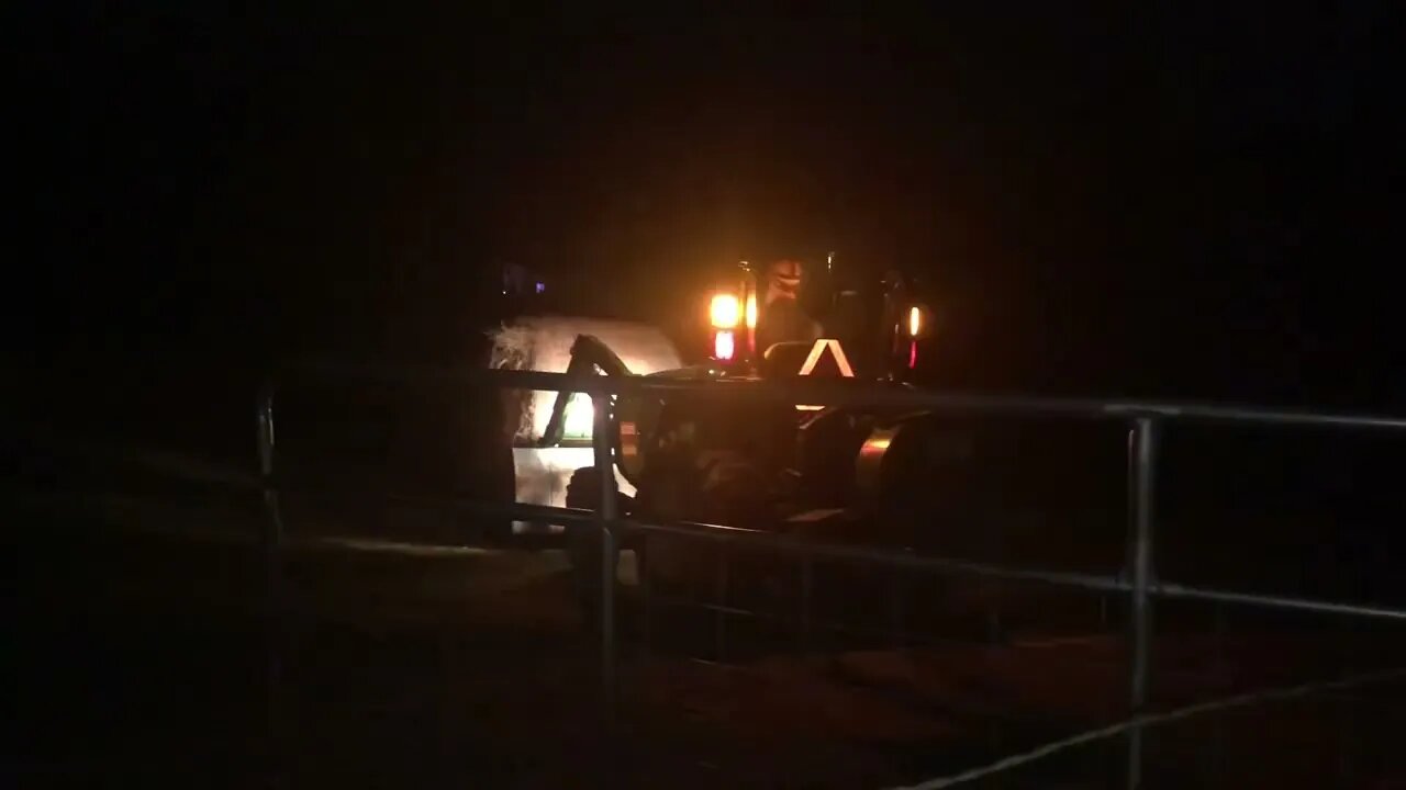 Moving a Huge Roll of Hay in the Dark