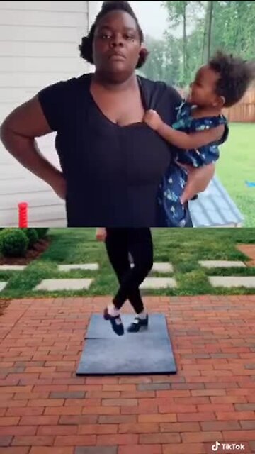 Mom hilariously "dances" while holding her baby