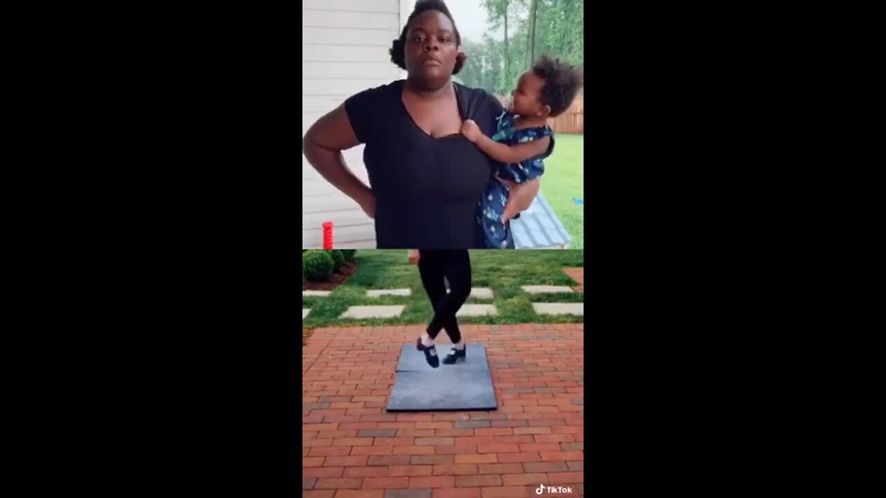 Mom hilariously "dances" while holding her baby