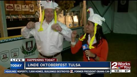 Doing the chicken dance to preview Oktoberfest Tulsa
