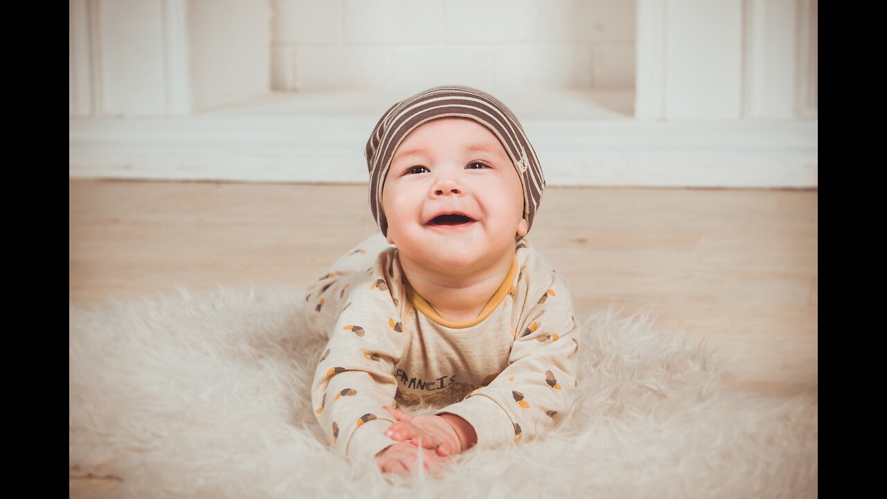 watch baby laughing at dog playing