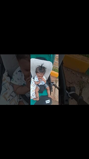 8 months old baby is drinking water after playing