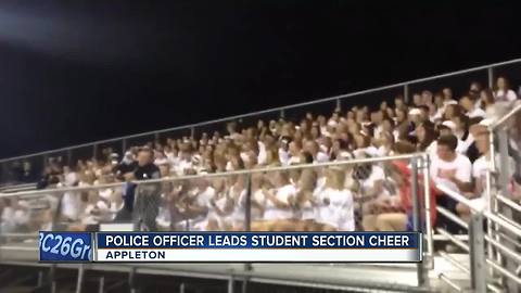 Appleton Police Officer leads student cheer