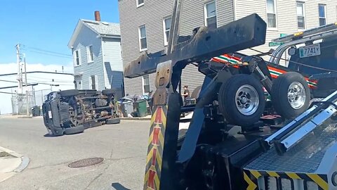 Boston police and fire respond to a pickup truck rollover on Magazine Street