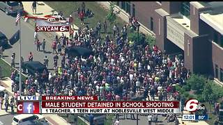 Crowd of parents picking up students at Noblesville High School