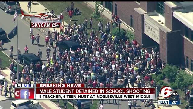 Crowd of parents picking up students at Noblesville High School