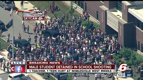 Crowd of parents picking up students at Noblesville High School