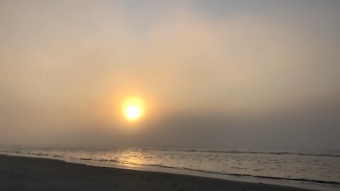 Foggy morning beach walk