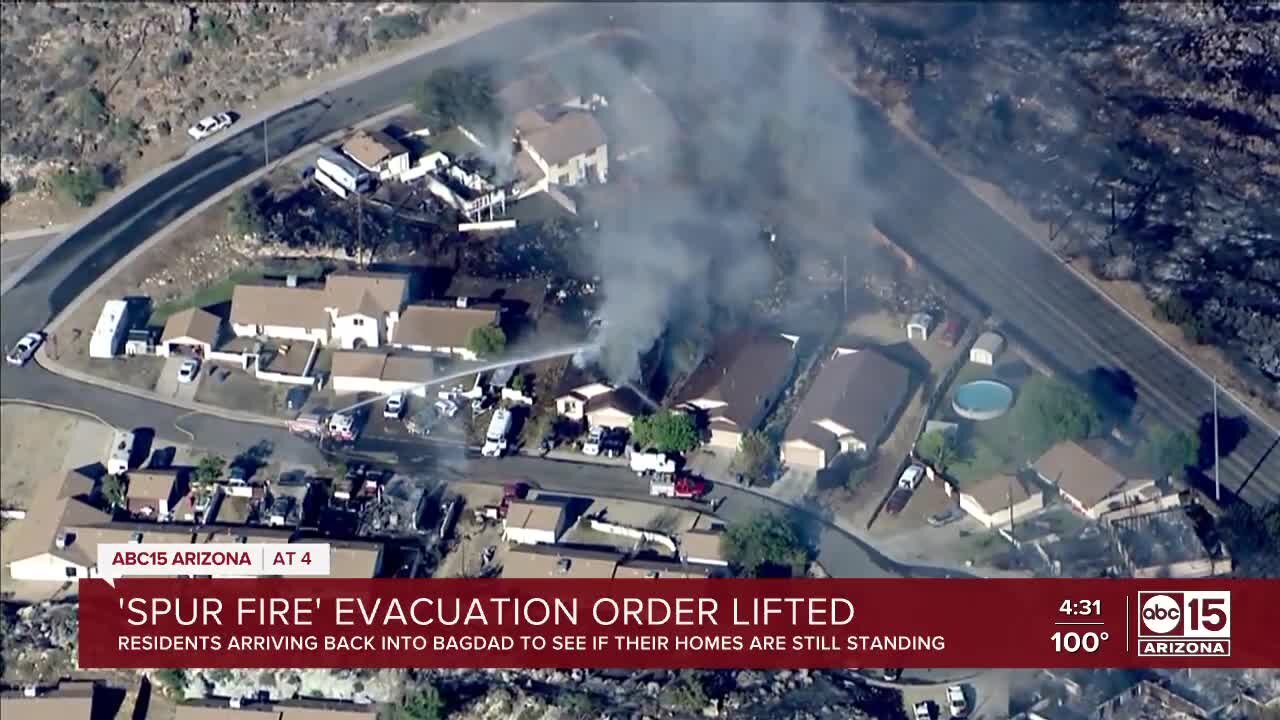 Some residents arrive back to their homes after the Spur Fire in Bagdad, AZ