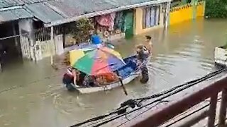 Overcrowded boat causes people to fall off