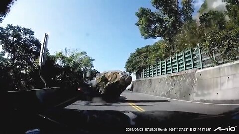 dash cam shows a car getting taken out by a massive rock during the 7.4 magnitude earthquake Taiwan