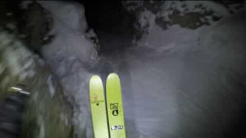 Skier descends mountain at night!