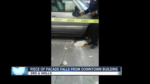 Concrete falls off downtown building 8 stories onto SUV below