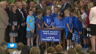 Walker signs state budget at Neenah elementary school nearly 3 months late