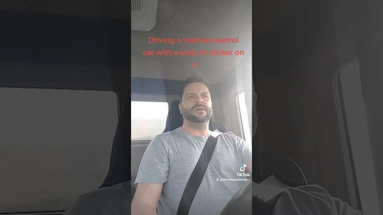 stop oil sticker on the back of a petrol car