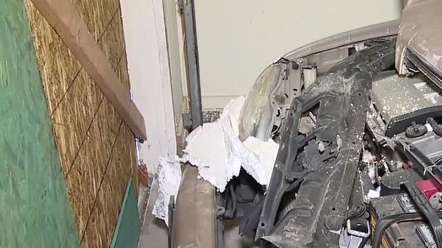 Truck crashes into east Las Vegas garage, damaging resident's car