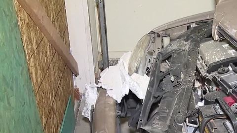 Truck crashes into east Las Vegas garage, damaging resident's car