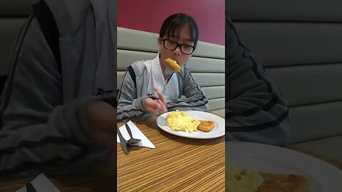 Cute baby sisters eat the best breakfast at Travelodge Crawley U,k- english breakfast