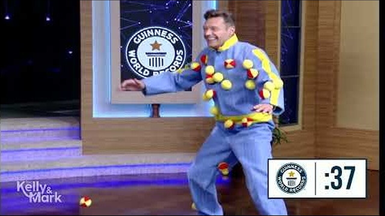 Mark and Ryan Seacrest Attempt to Break Record for Most Balls Caught on a Velcro Suit in One Minute