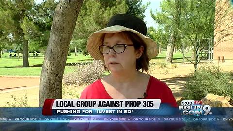 Teachers pass out Red for Ed stickers