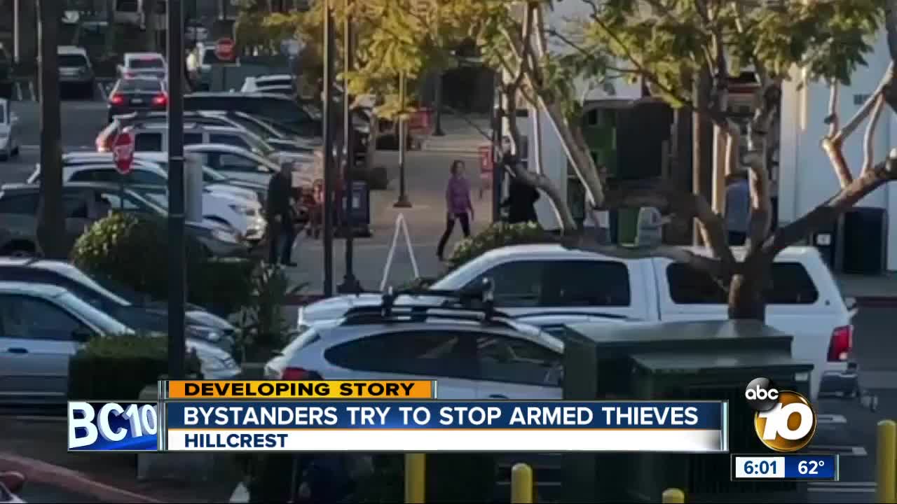 Bystanders try to stop armed thieves