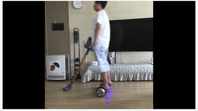 Dad uses hoverboard to clean the floors