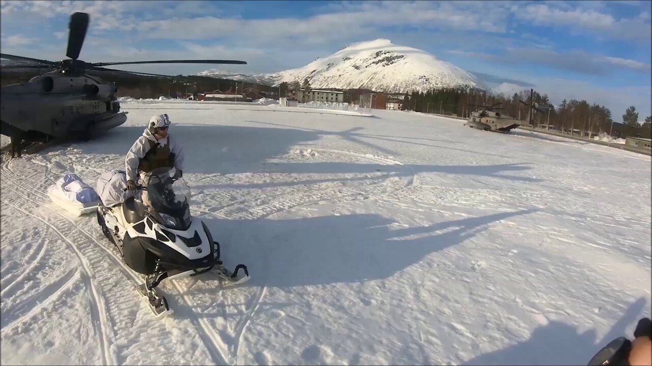 Norwegian Soldiers Ride Snowmobiles out of Marine Corps Helicopters