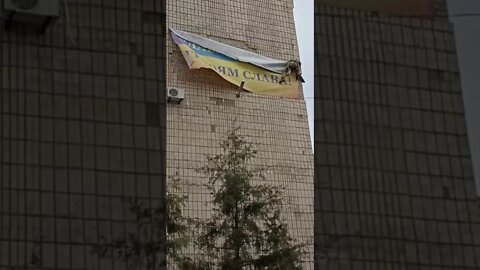 Russians in Melitopol removing banner