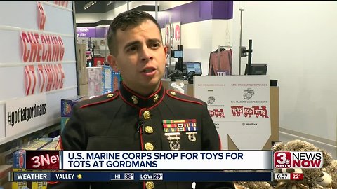 USMC shops for Toys for Tots at Gordman's