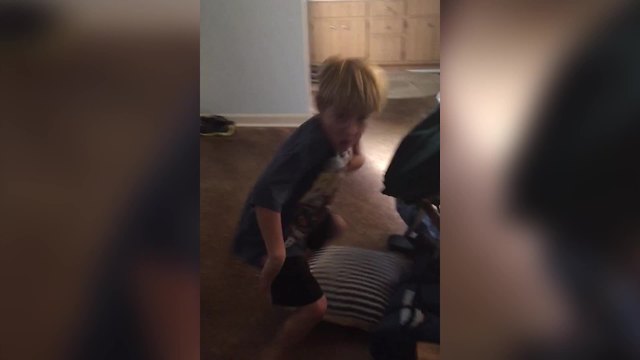 A Young Boy Dances As Goofy