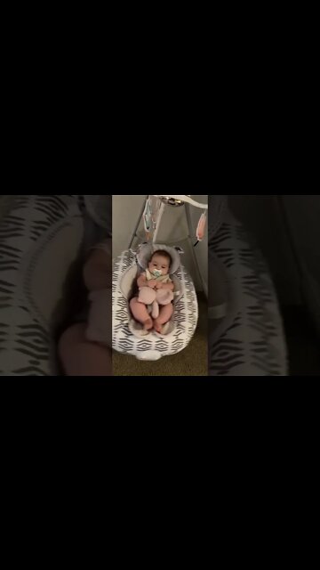 Cute adorable baby child with warm white and pink hat with cute baby girl