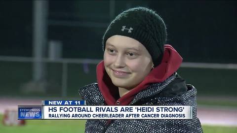 Football rivals put aside differences to support cheerleader fighting cancer