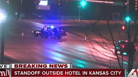 Police working active standoff at hotel in KCMO