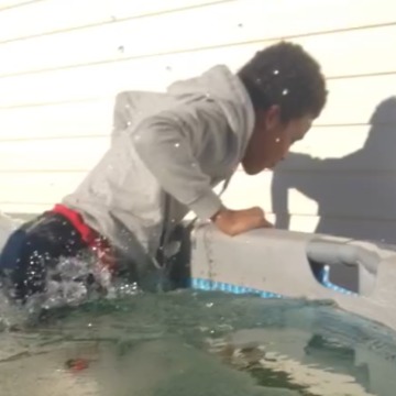 A Young Boy Falls Into a Frozen Pool