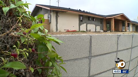 Man sets house on fire, points gun at construction workers