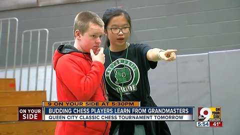 Budding chess players learn from grandmasters