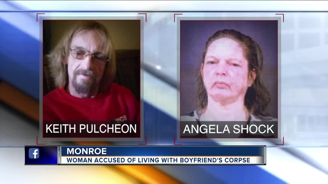 Metro Detroit woman lived with boyfriend's dead body for weeks, police say