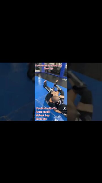 Duck under to school boy knee bar