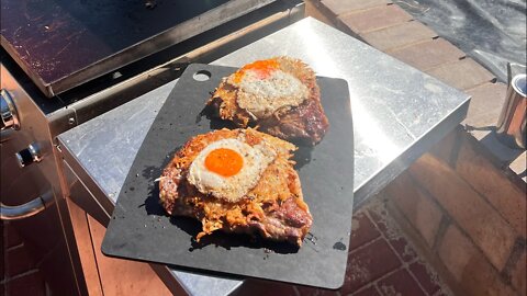 Steak, eggs and hash browns on the griddle