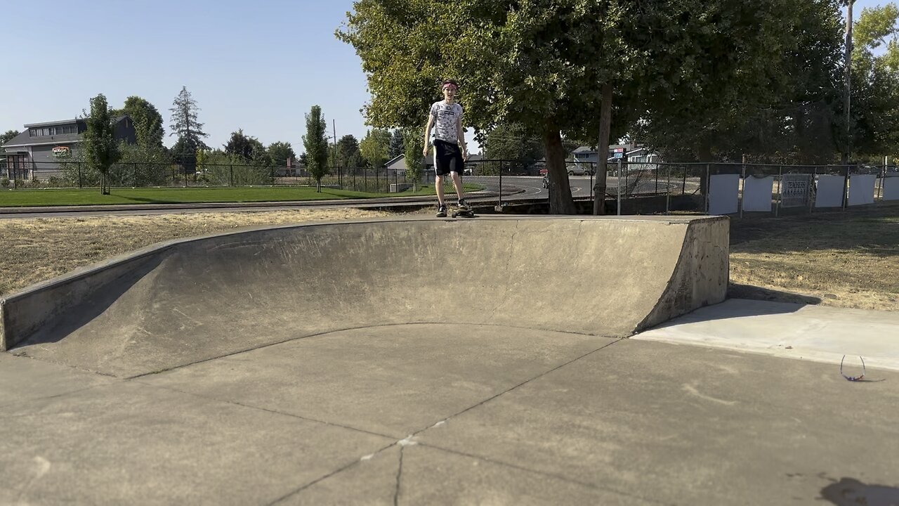 Yung Alone Rides His Long Board Down Independence Skate Park Ramp