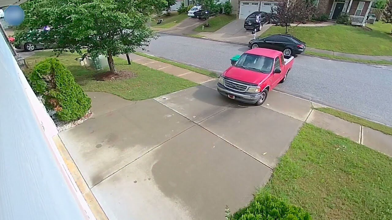 Delivery Truck Hits Parked Car While Reversing Out of Driveway