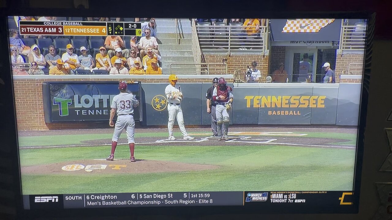 The Engineer from TF2 at college Baseball game