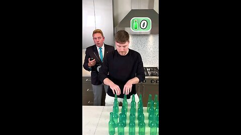 Making World record smashing bottles on head