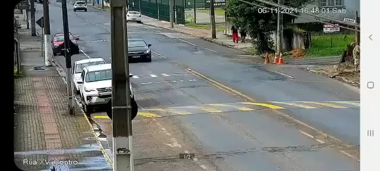 Motorcycle doing a wheelie crashes Into car