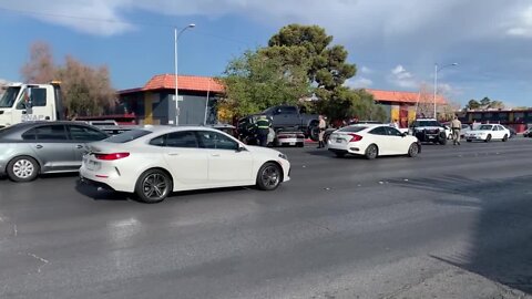 Pickup truck lays on sedan after crash on Eldora and Decatur