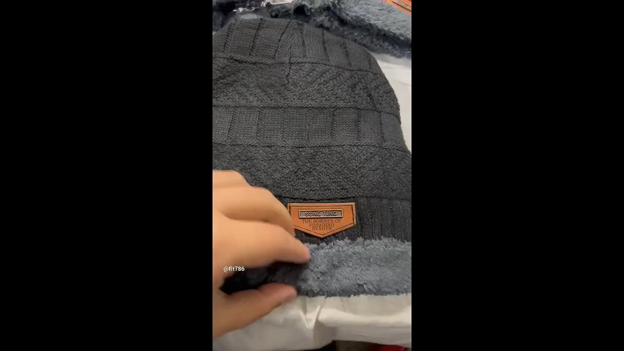 Winter knitted beanie cap with warmer