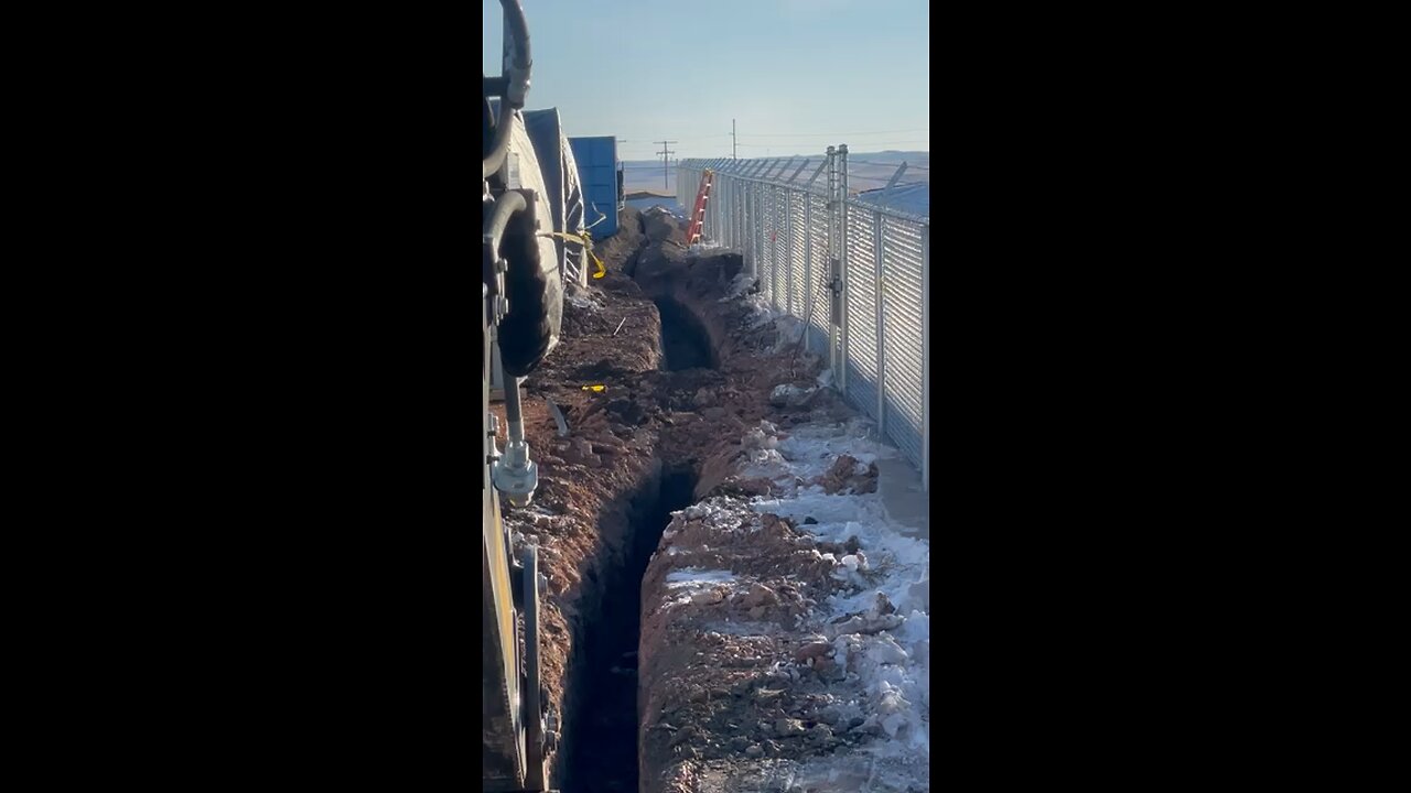 Digging trench with backhoe