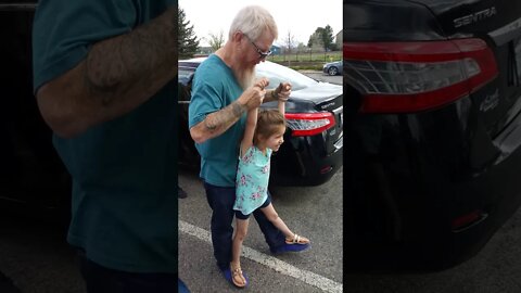 Bella Giggles Walking on Grandpa's Feet