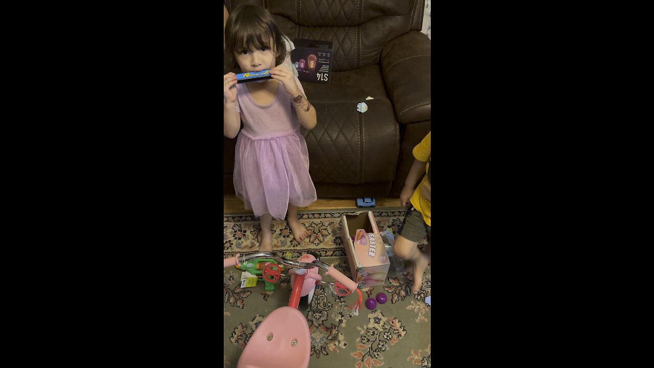 My Daughter Playing The Harmonica